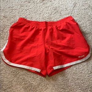 Red Reebok running shorts, sz M